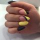 Fashionable yellow and black manicure