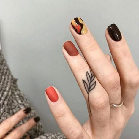 Interesting nail design in dark colors
